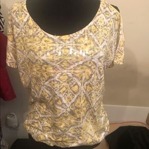 Cold shoulder top. Gather at the bottom